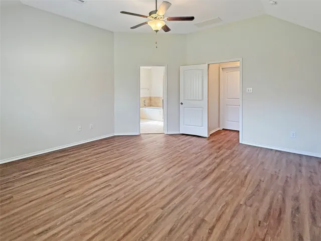 a bathroom with a bathtub shower sink and mirror