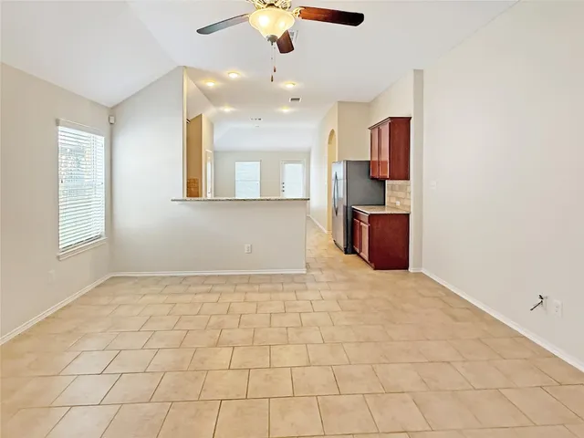 a large bathroom with a granite countertop sink and a granite counter top