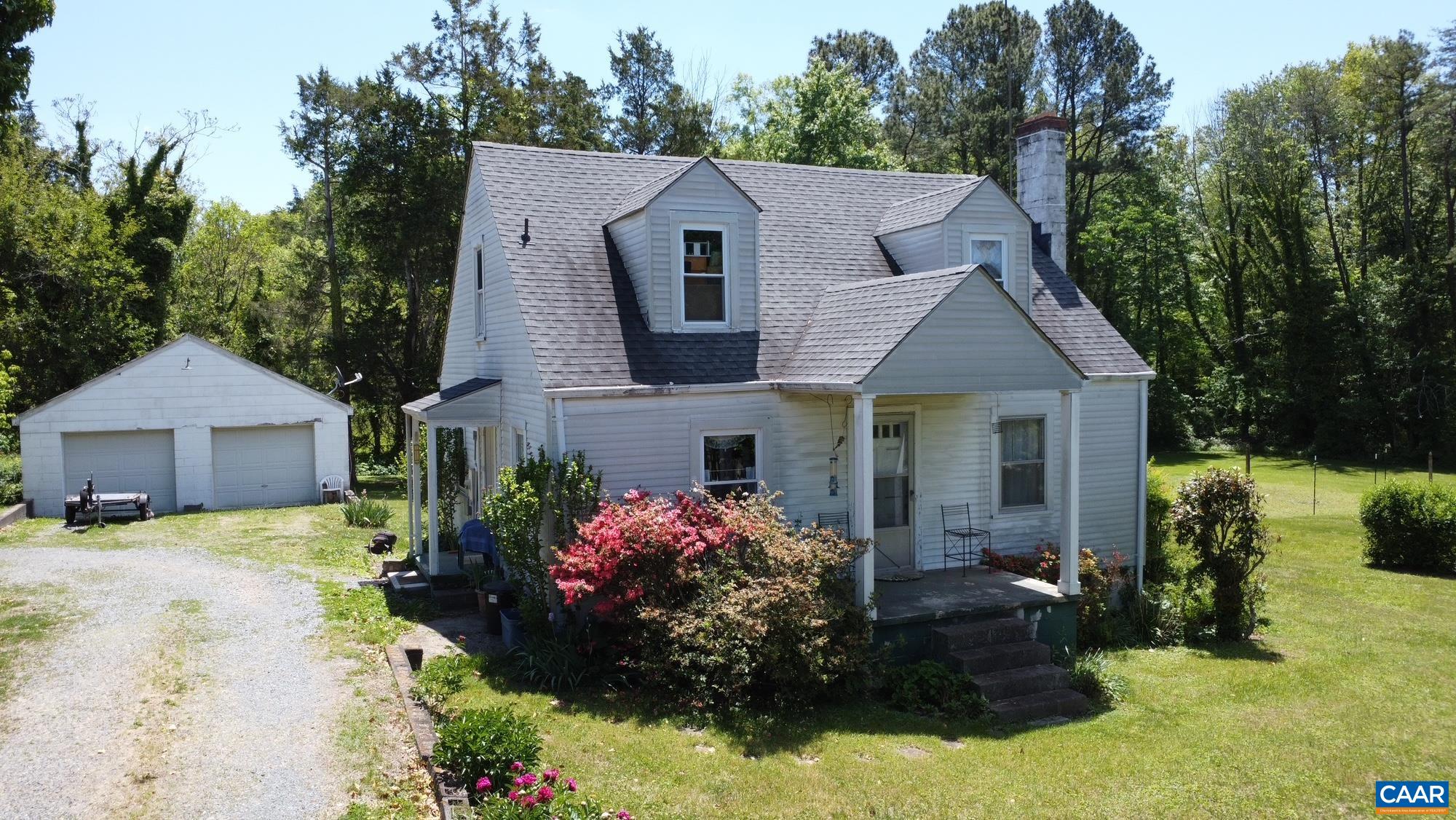 5441 Gordonsville Road Keswick, VA 22947 - Photo 5 of 6 a front view of a house with a yard and garage