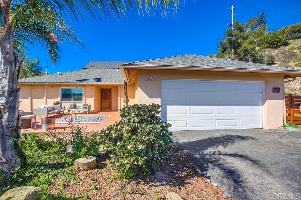 328 Hilmen Drive Solana Beach, CA 92075 - Photo 1 of 19 a front view of a house with garden