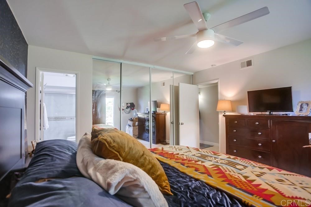 328 Hilmen Drive Solana Beach, CA 92075 - Photo 11 of 19 a living room with a bed and a television