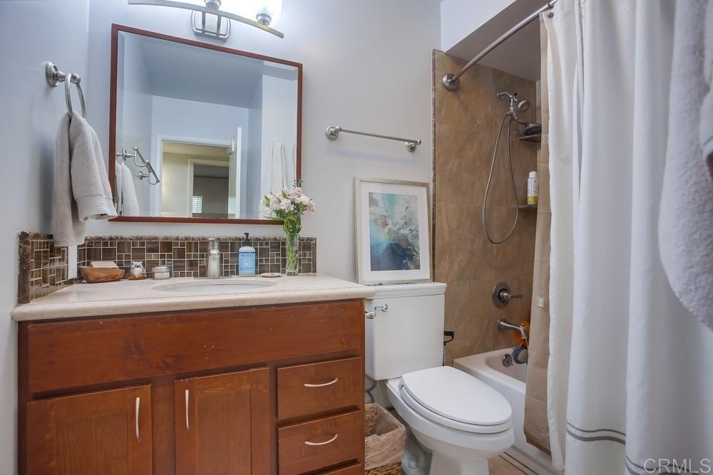 328 Hilmen Drive Solana Beach, CA 92075 - Photo 13 of 19 a bathroom with a toilet a sink and a mirror