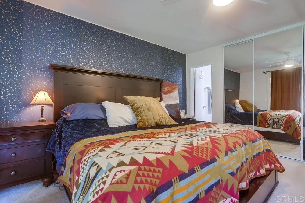 328 Hilmen Drive Solana Beach, CA 92075 - Photo 10 of 19 a bedroom with a bed and a lamp