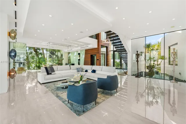 a kitchen with stainless steel appliances a table and chairs