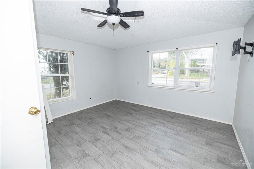 217 South Bridge Avenue Weslaco, TX 78596 - Photo 4 of 7 a view of an empty room with a window