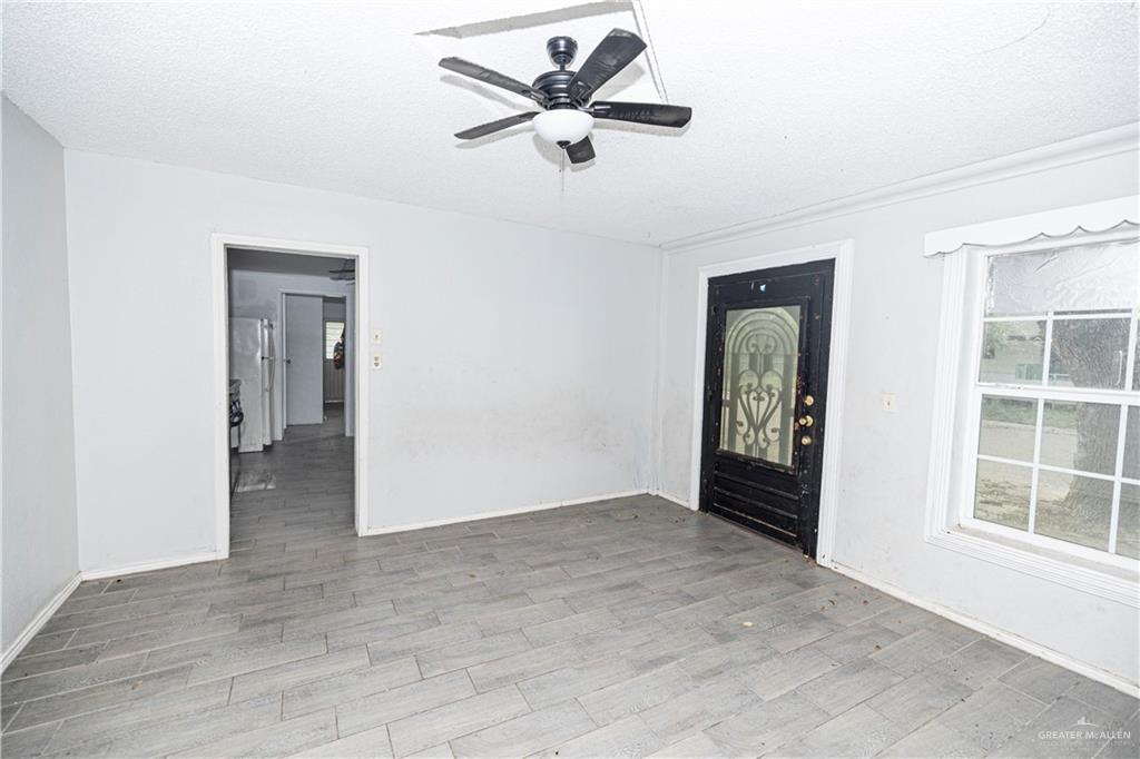 217 South Bridge Avenue Weslaco, TX 78596 - Photo 6 of 7 an empty room with fan and windows