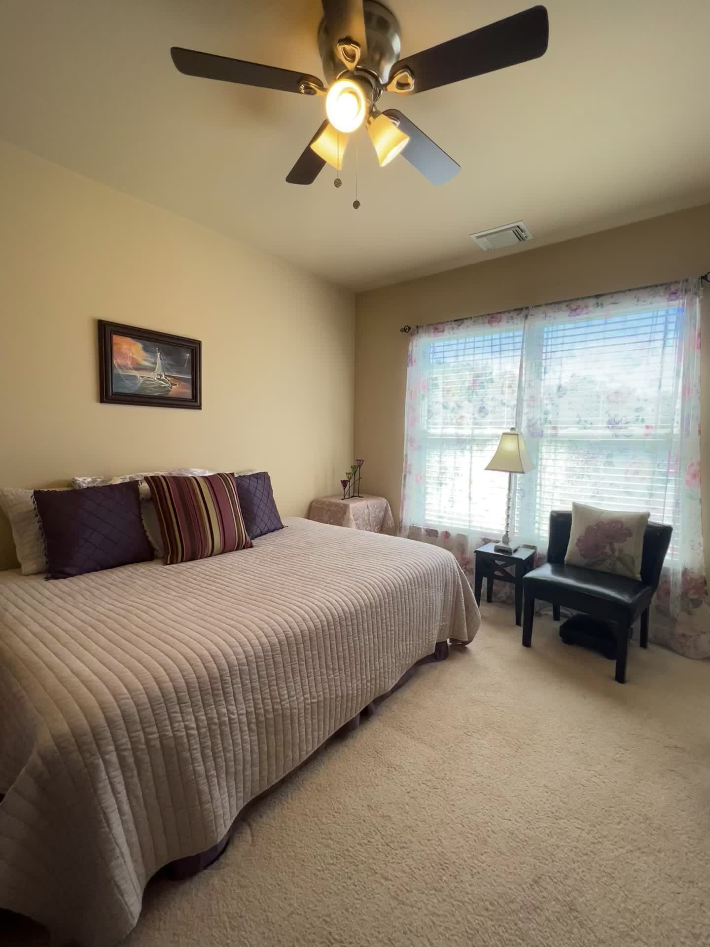 1382 Rural Hill Road, Unit 189 Antioch, TN 37013 - Photo 12 of 16 a bedroom with a bed and a chandelier