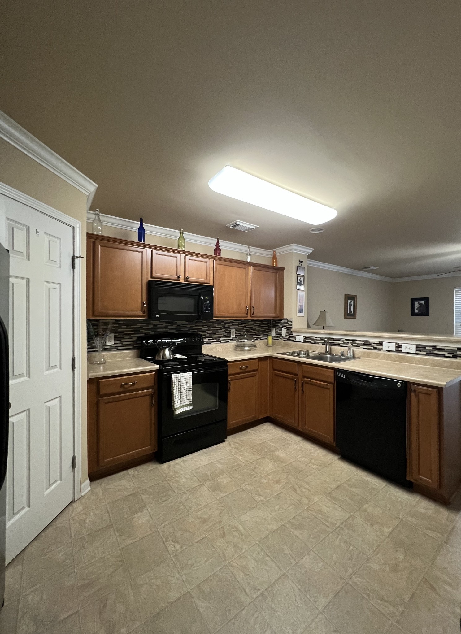1382 Rural Hill Road, Unit 189 Antioch, TN 37013 - Photo 3 of 16 a large kitchen with a stove top oven and sink