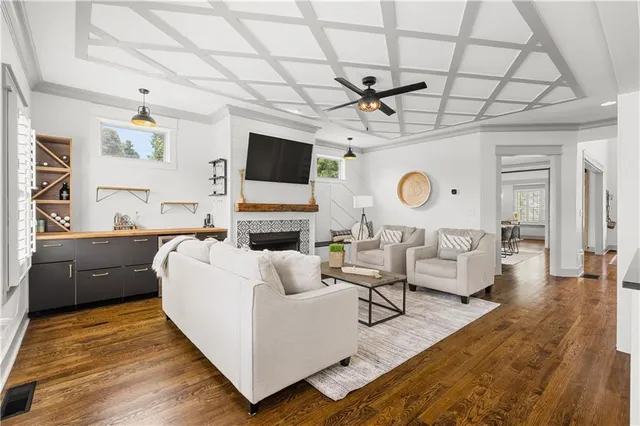 a kitchen with stainless steel appliances a sink cabinets and a window