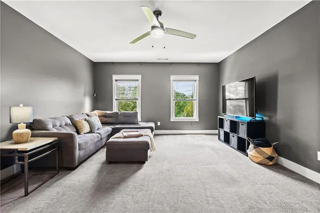 a bathroom with a bathtub shower sink and mirror