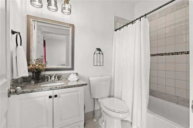 a view of walk in closet with clothes