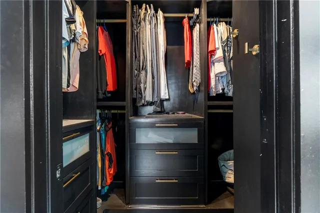 a view of a garage with rack and bicycle