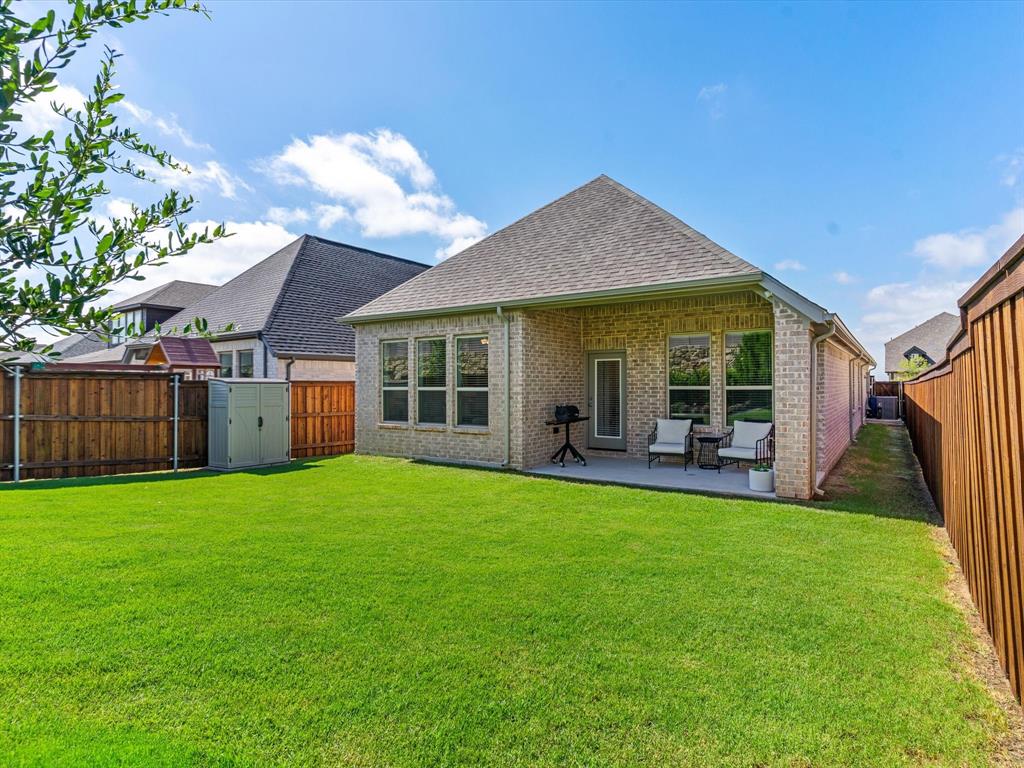 166 Palo Duro Bend Rhome, TX 76078 - Photo 37 of 40 Fenced backyard with room for recreation, pets, or gardening.