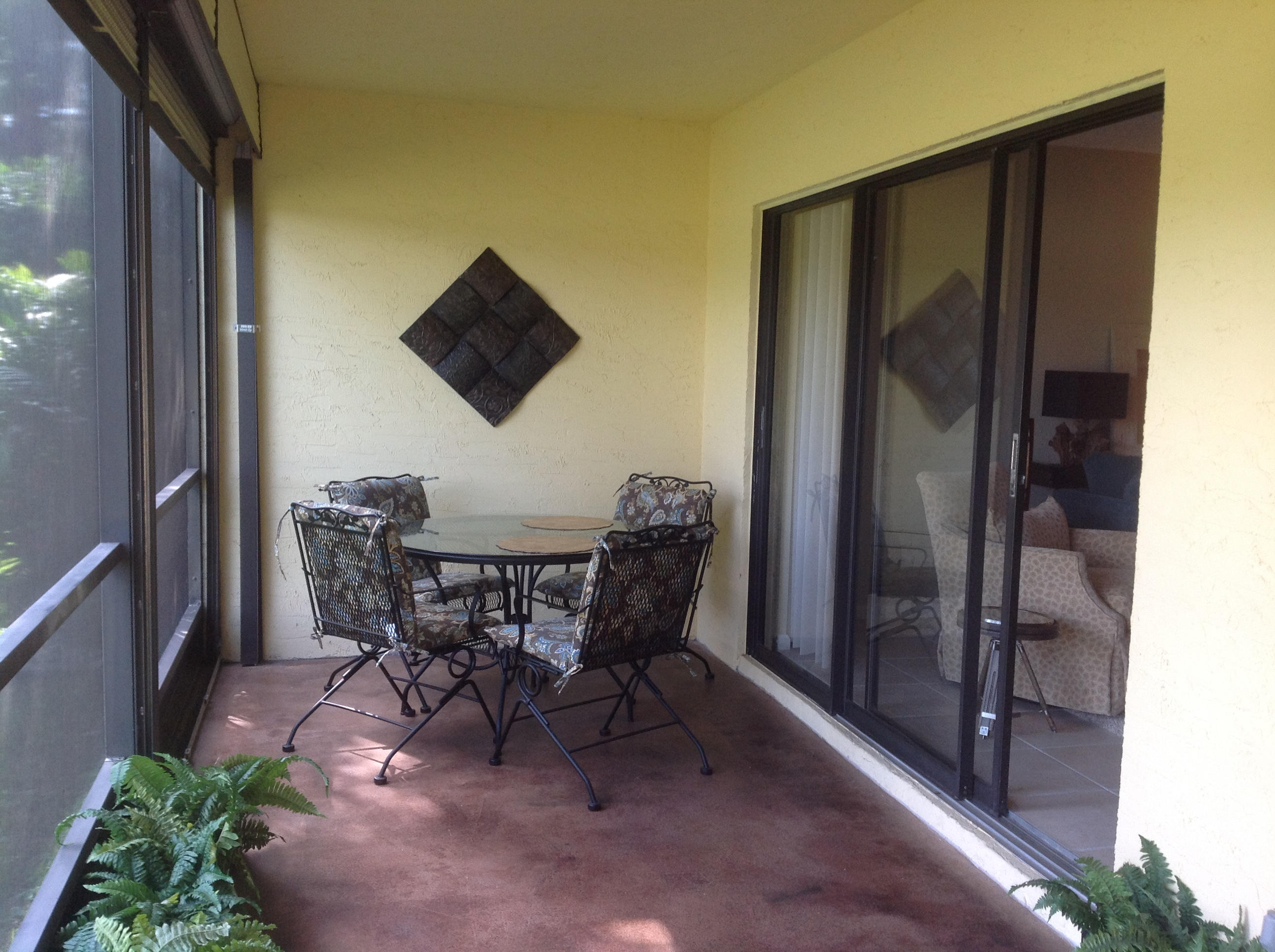 1101 Keystone Drive, Unit C Jupiter, FL 33458 - Photo 20 of 23 SCREENED PATIO WITH STORAGE CLOSET