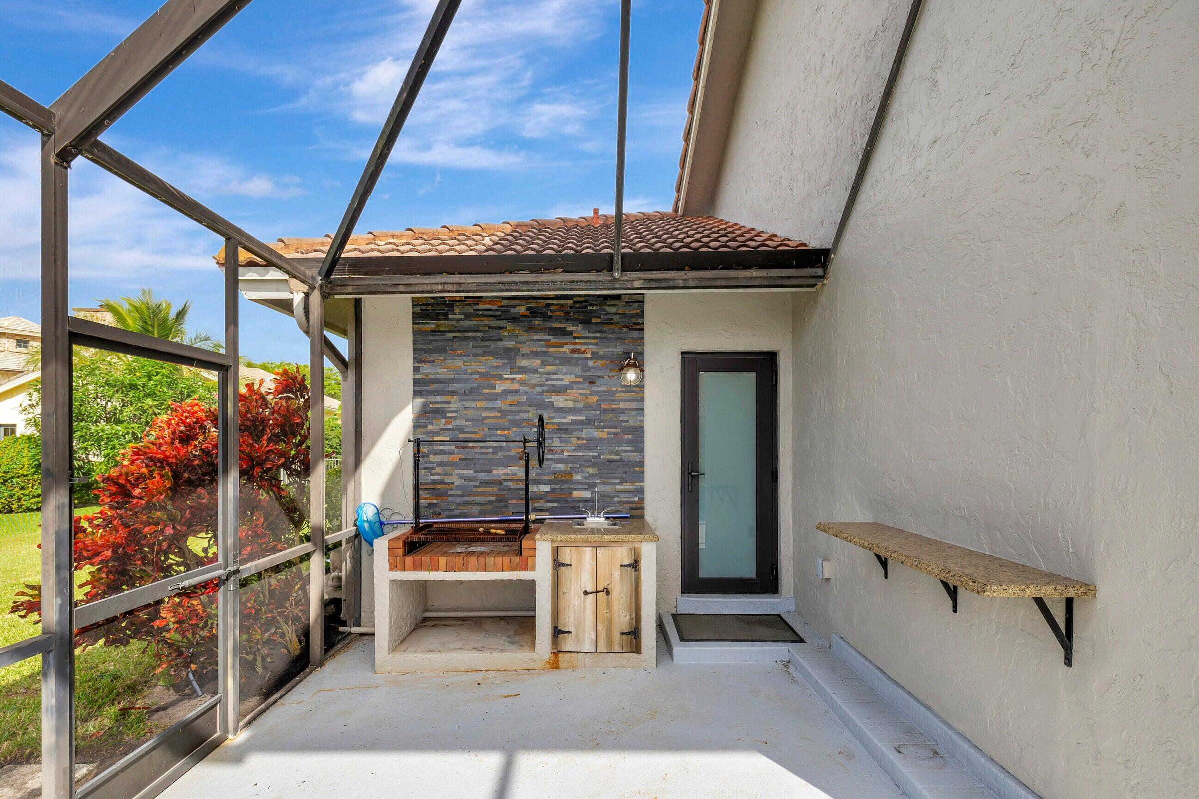 4875 Hunters Way Boca Raton, FL 33434 - Photo 35 of 43 BBQ area and Cabana Enrtrance