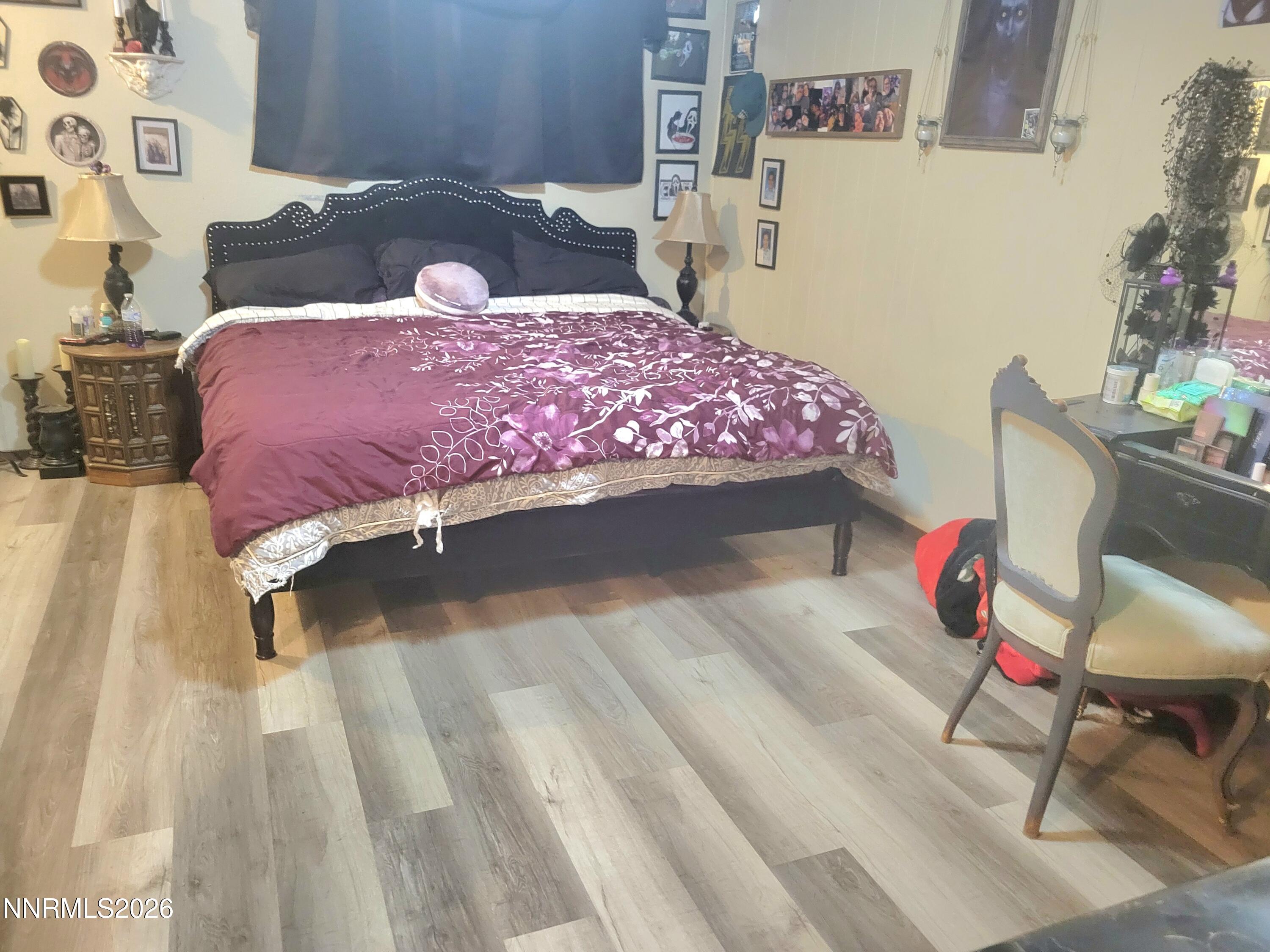 1404 East 9th Street, Unit 3 Reno, NV 89512 - Photo 18 of 29 a bedroom with a bed dresser and a dining table chair