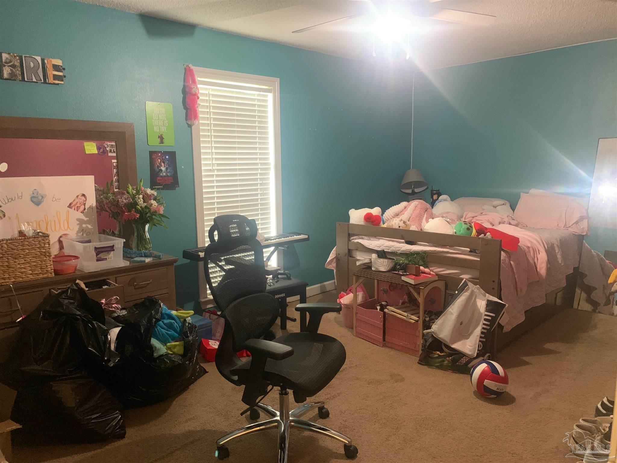 5154 Seneca Trail Milton, FL 32583 - Photo 12 of 20 a bedroom with bed and a large window