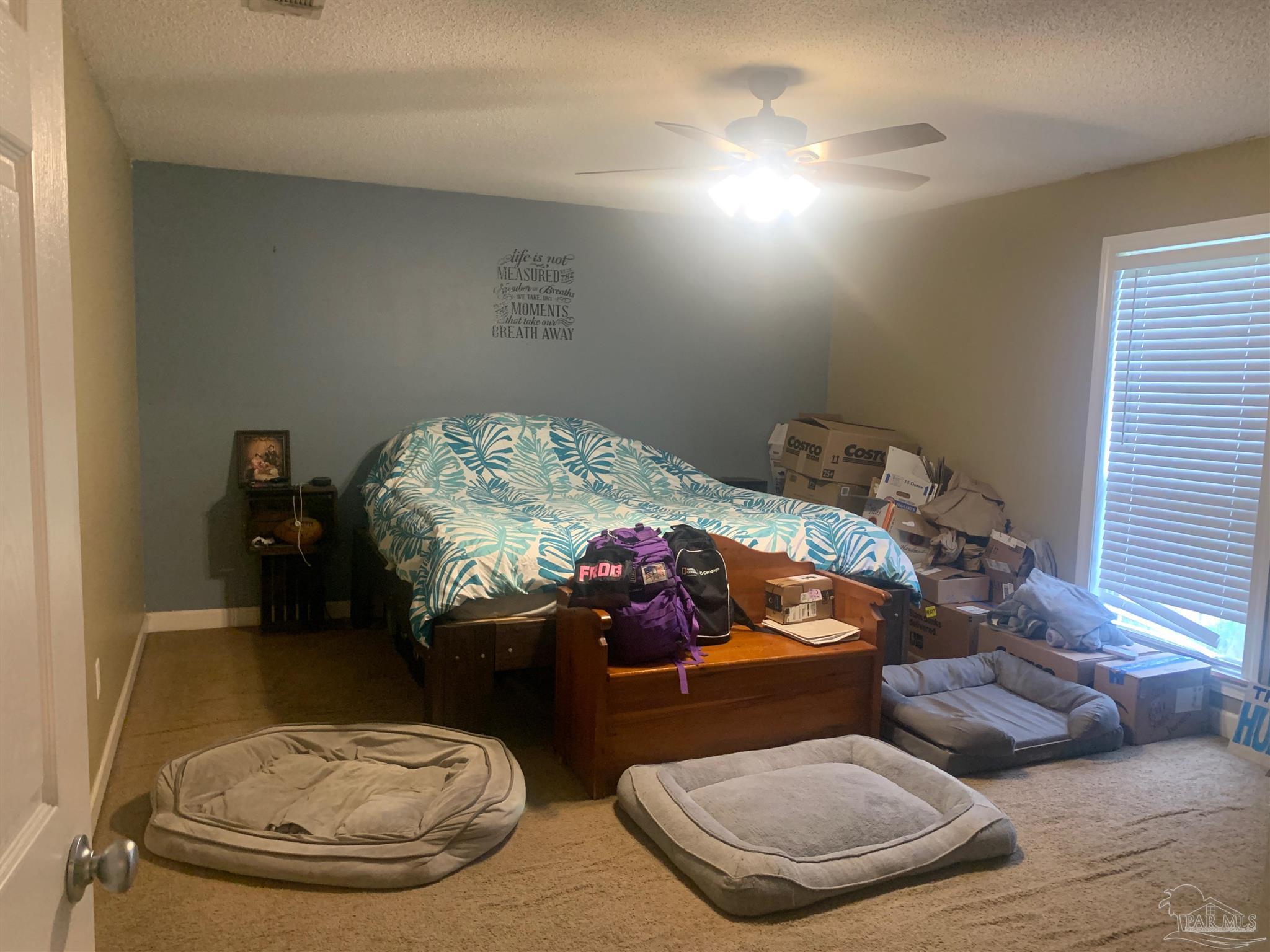 5154 Seneca Trail Milton, FL 32583 - Photo 5 of 20 a living room with furniture and a fireplace