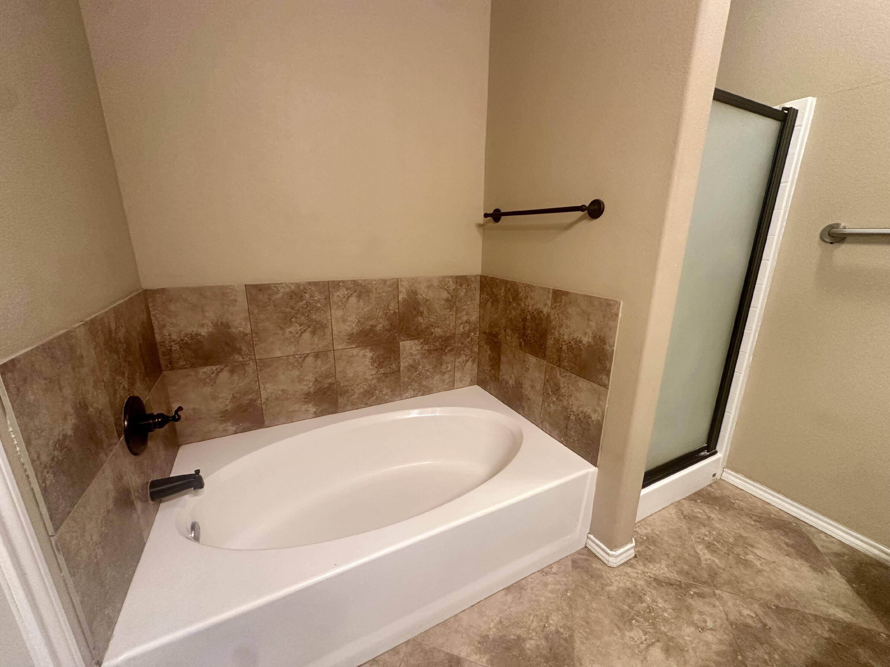 4423 106th Street, Unit A Lubbock, TX 79424 - Photo 15 of 23 a bathroom with a bathtub