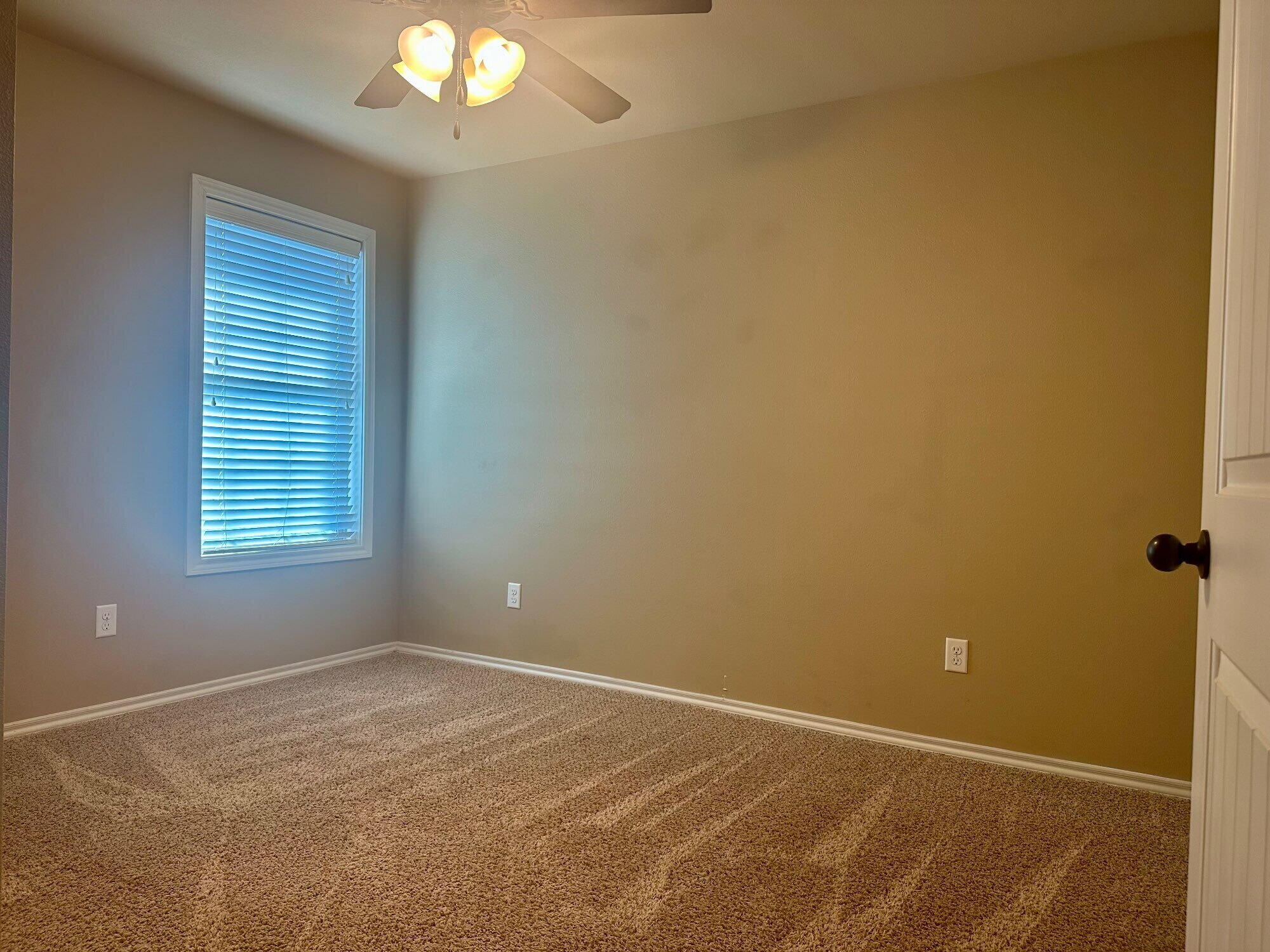 4423 106th Street, Unit A Lubbock, TX 79424 - Photo 20 of 23 a view of an empty room with a window