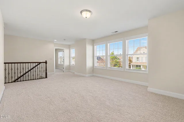 a bathroom with a granite countertop sink a toilet and a shower
