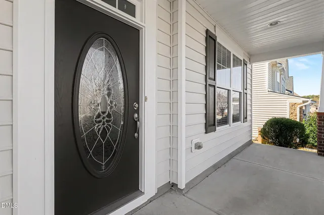 a view of a entryway door with wooden floor