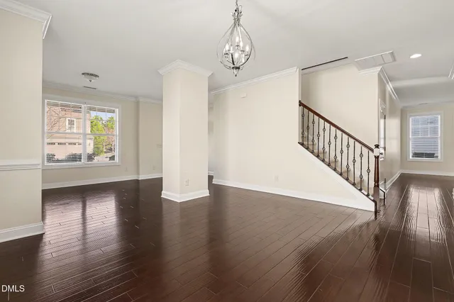a view of an entryway with wooden floor