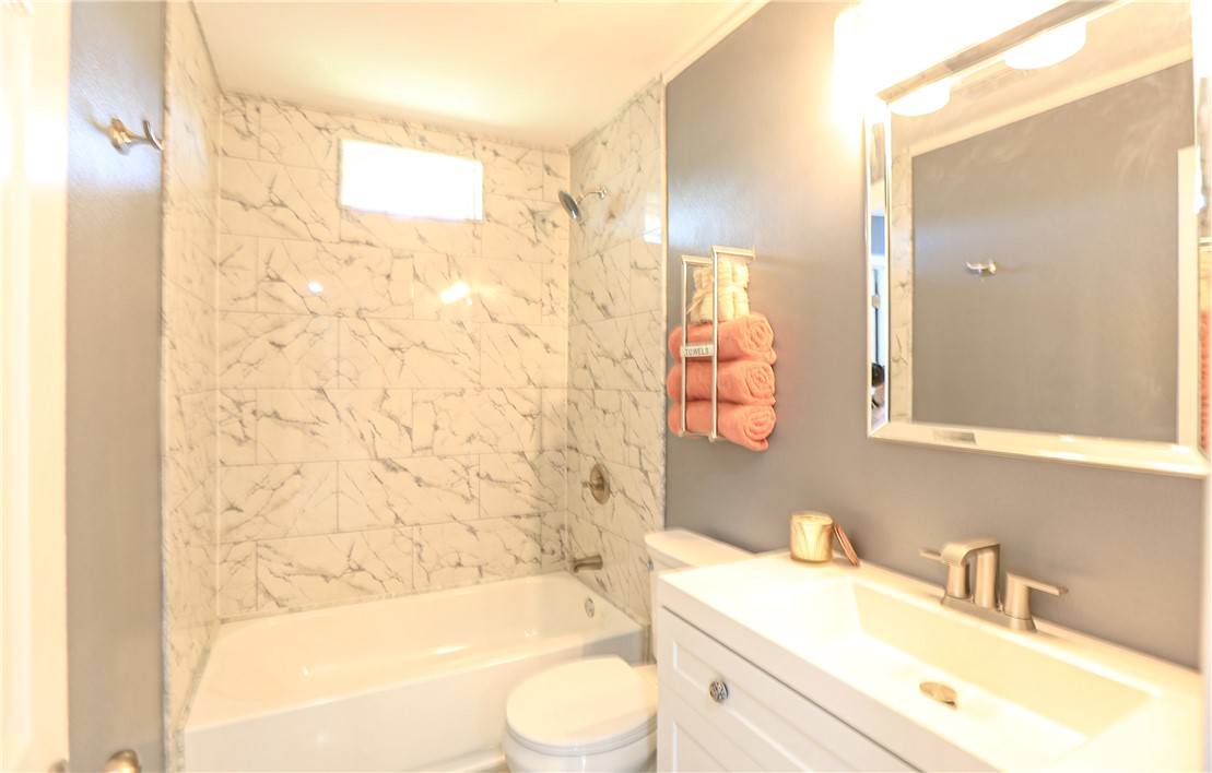 700 North Cameron Street Alice, TX 78332 - Photo 7 of 17 a bathroom with a sink a toilet and shower