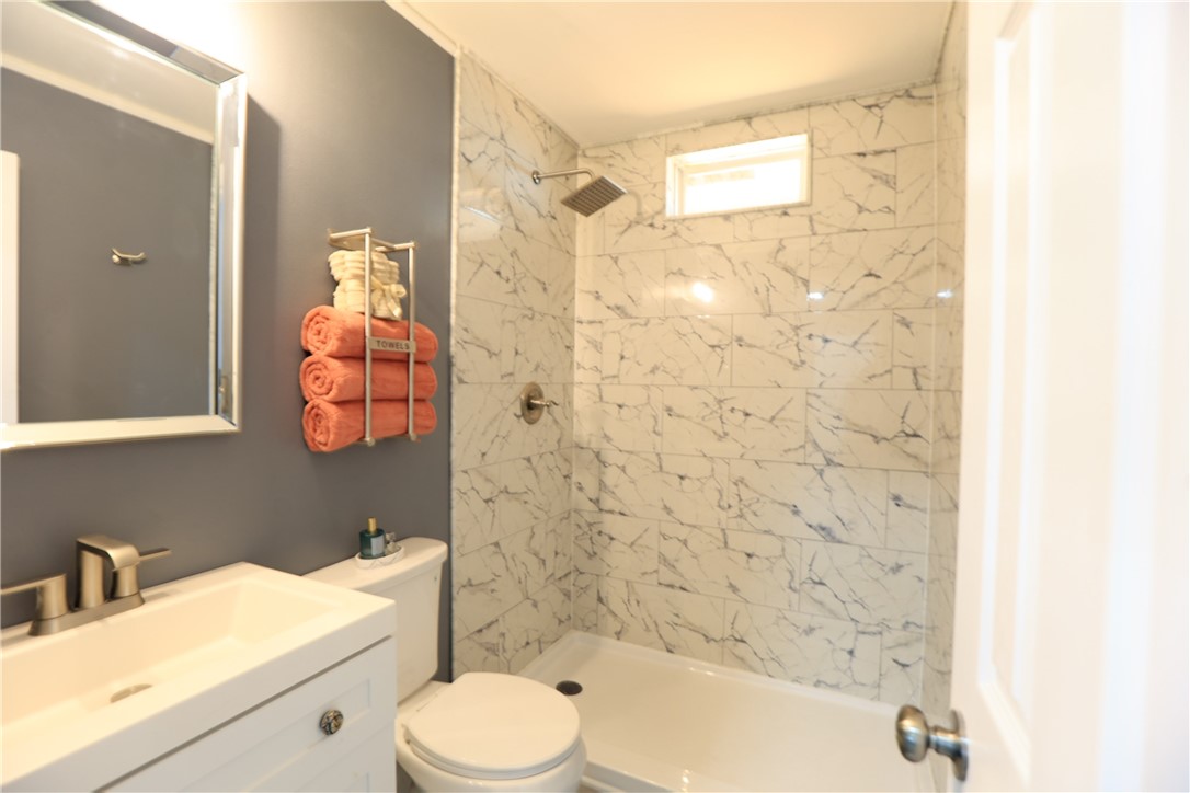 700 North Cameron Street Alice, TX 78332 - Photo 8 of 15 a bathroom with a bathtub shower sink mirror and toilet