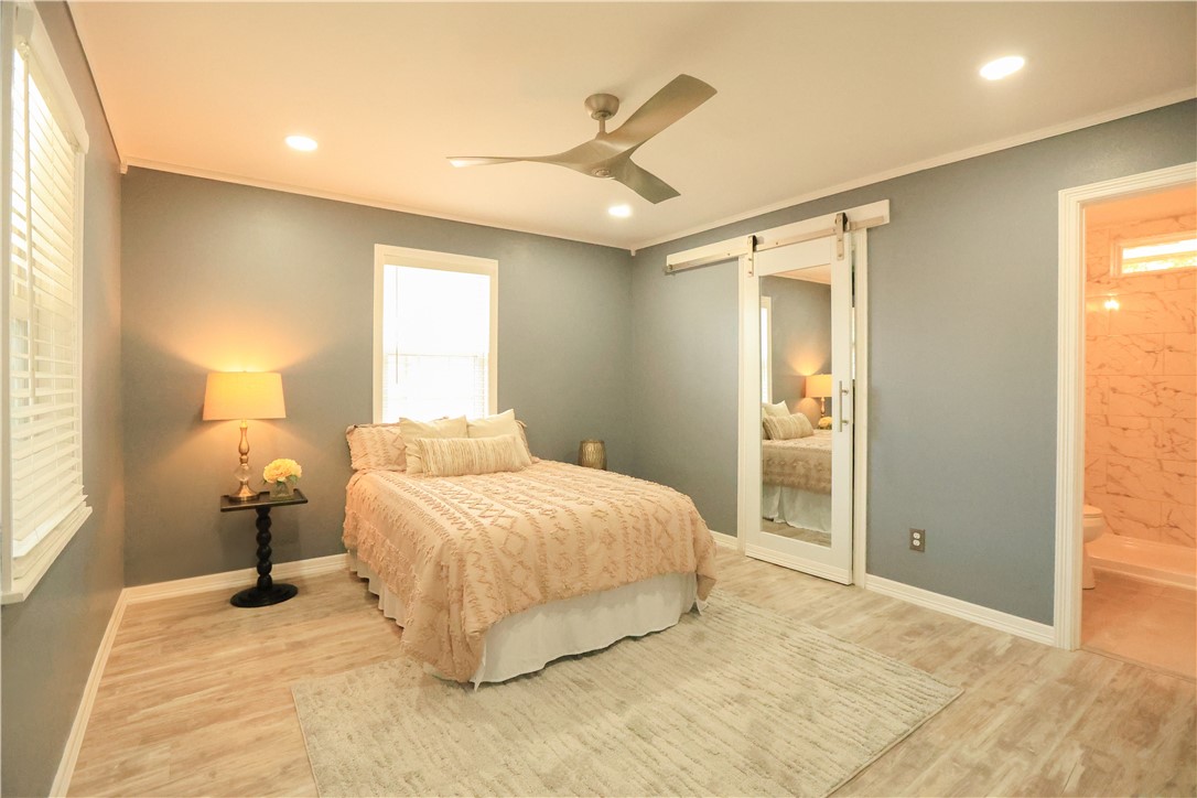 700 North Cameron Street Alice, TX 78332 - Photo 9 of 17 a bedroom with a bed and a window