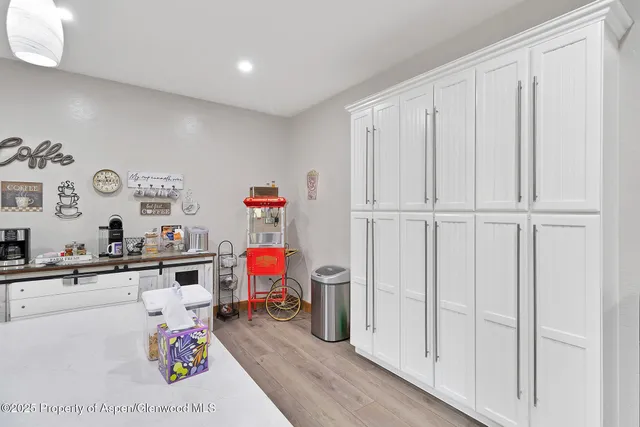 a utility room with lots of clutter and storage