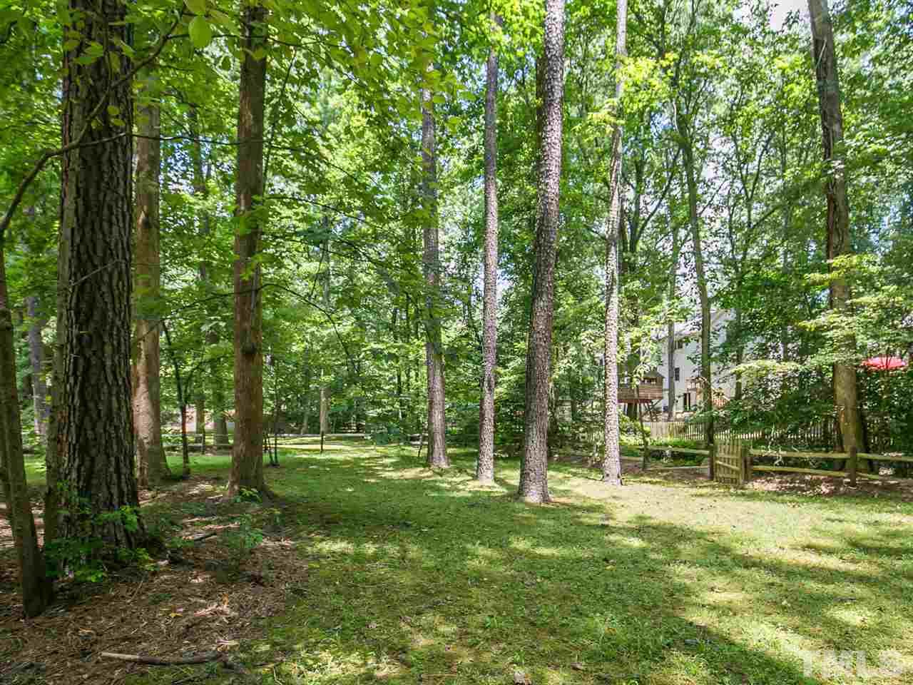 6116 Bayberry Lane Raleigh, NC 27612 - Photo 25 of 25 Peaceful wooded backyard with split rail fence