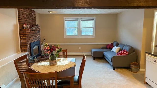 a view of a dining room with furniture and window