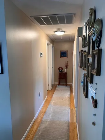 a view of a hallway with walk in closet