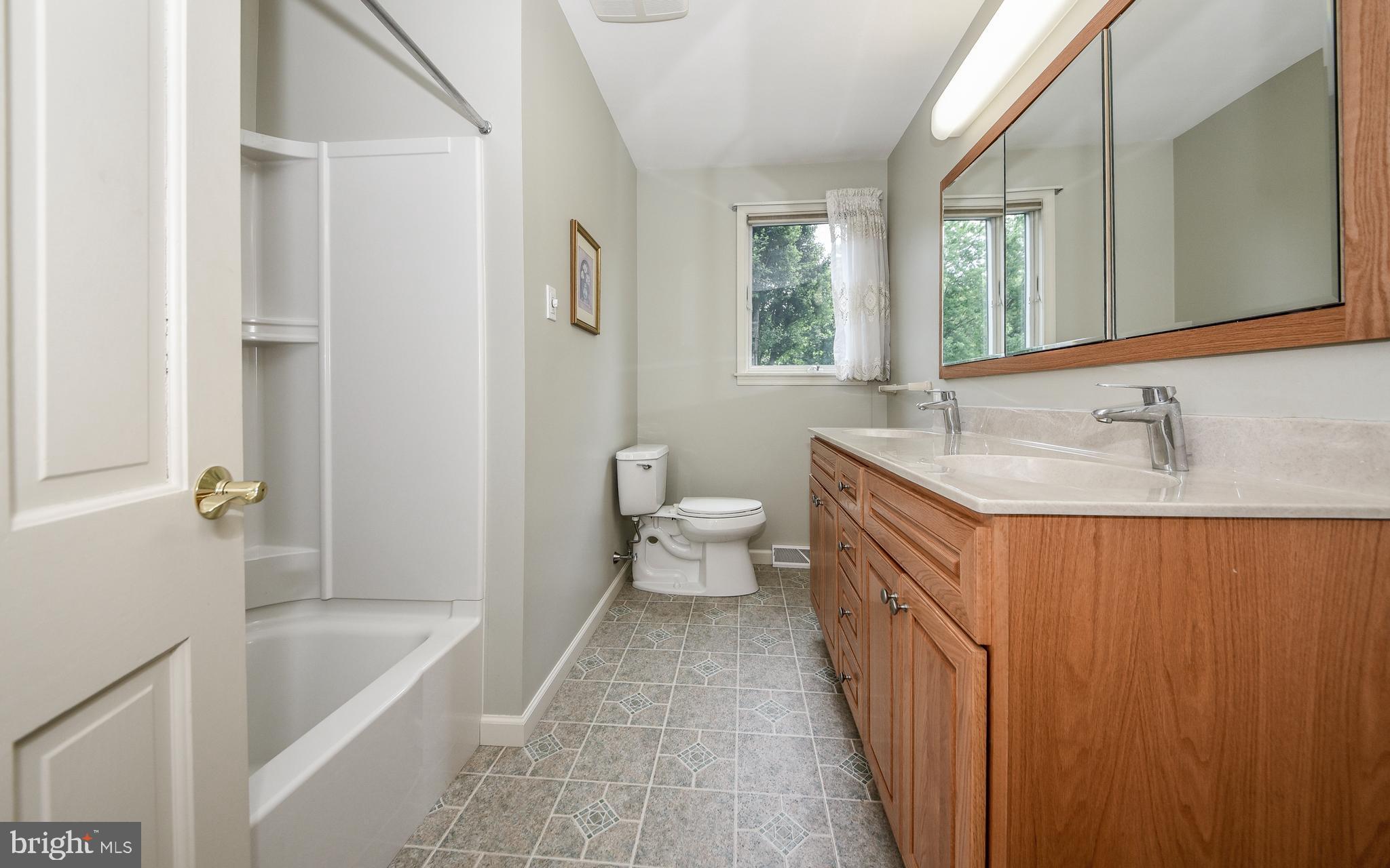 971 Lavera Road Warminster, PA 18974 - Photo 36 of 42 Squeaky Clean Hall Bath with Double Bowl Vanity