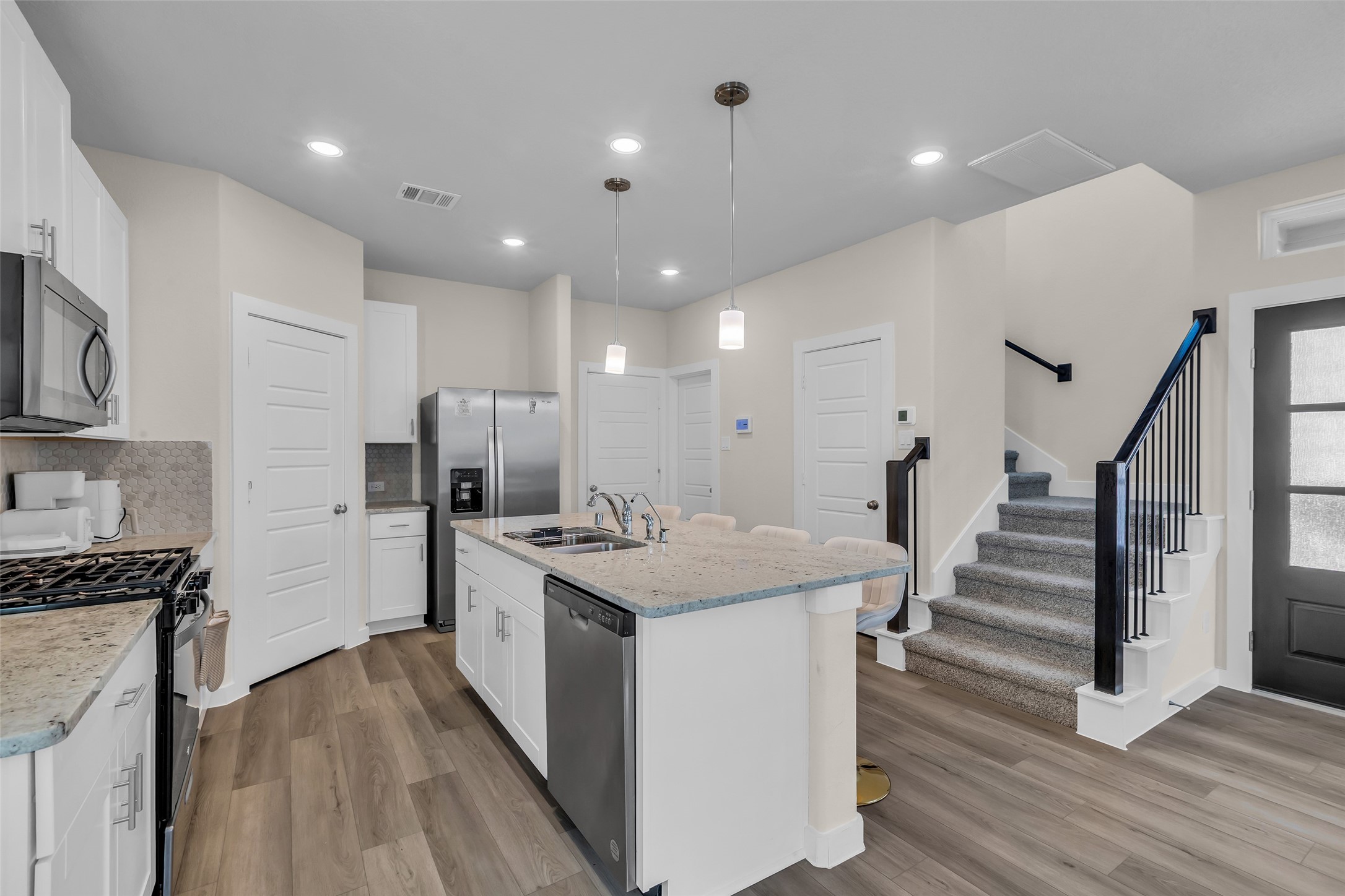 3109 Boulder Rnch Drive Houston, TX 77063 - Photo 15 of 26 a kitchen with sink stove and refrigerator