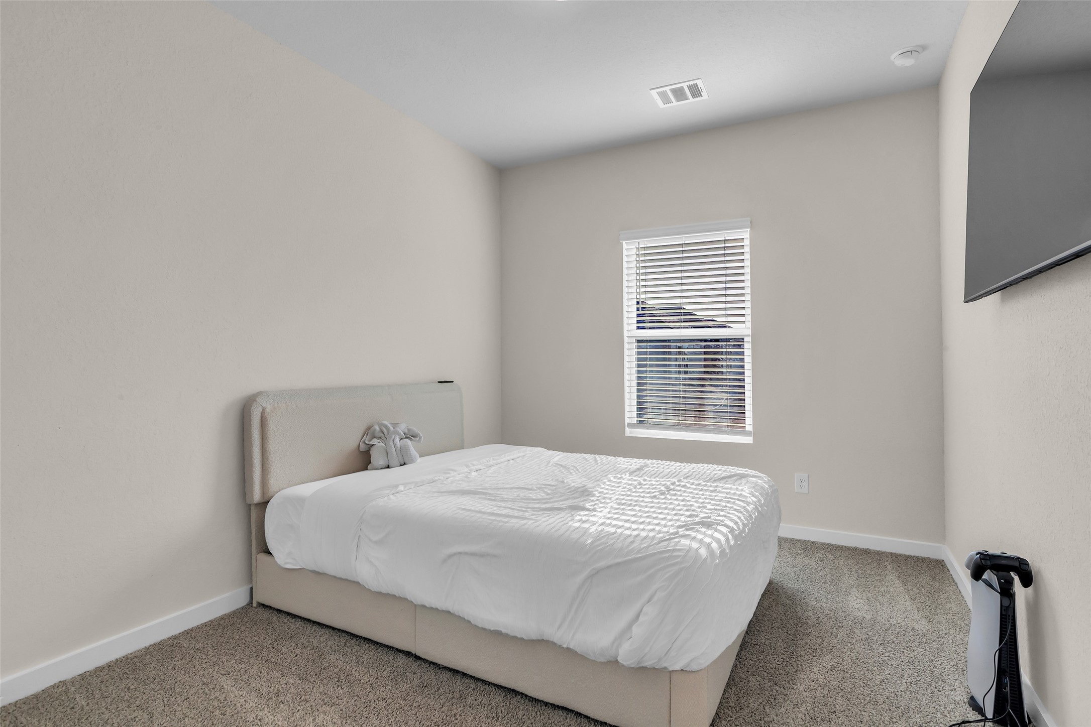 3109 Boulder Rnch Drive Houston, TX 77063 - Photo 19 of 26 a bedroom with a bed and a window