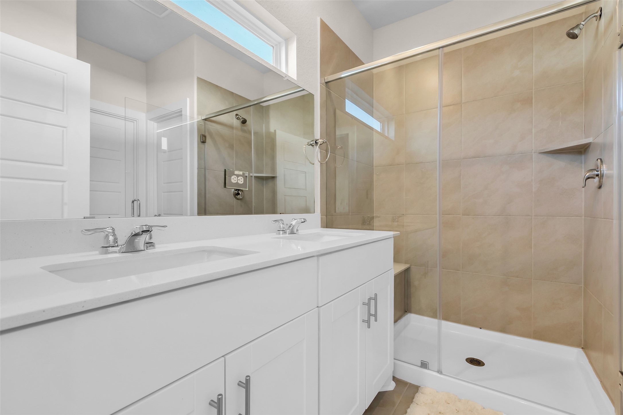 3109 Boulder Rnch Drive Houston, TX 77063 - Photo 21 of 26 a bathroom with a double vanity sink mirror and shower