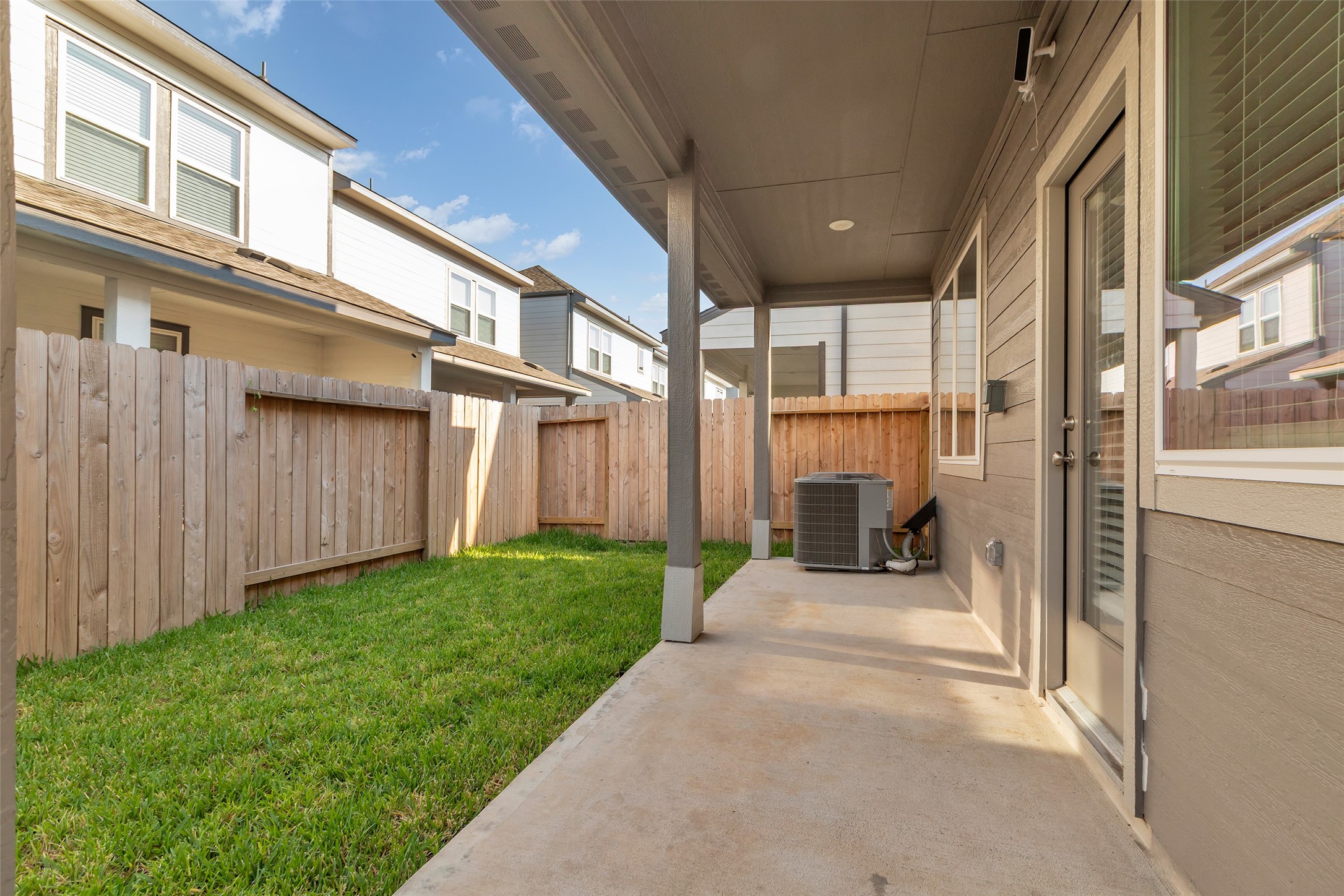 3109 Boulder Rnch Drive Houston, TX 77063 - Photo 24 of 26 a view of a porch with couches and wooden fence
