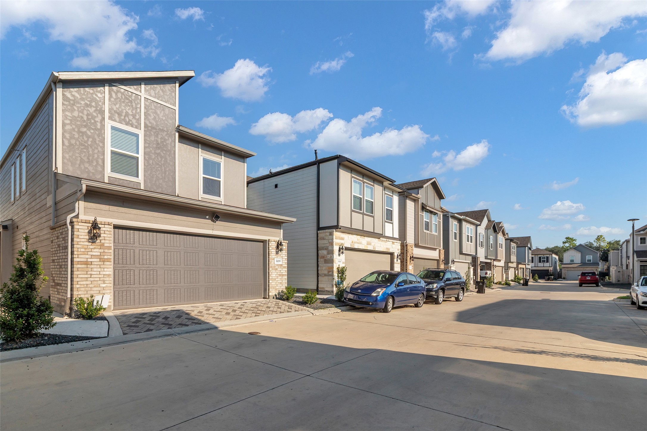 3109 Boulder Rnch Drive Houston, TX 77063 - Photo 4 of 26 a front view of a building with cars parked