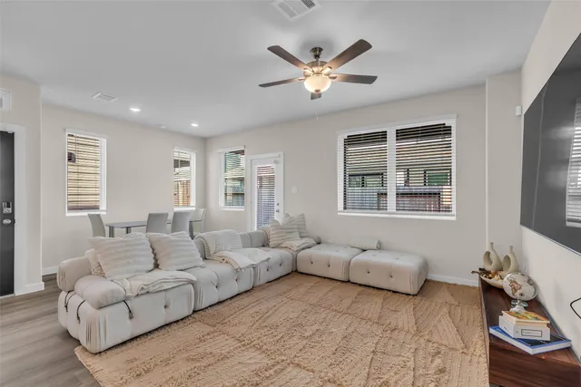 a living room with furniture and windows