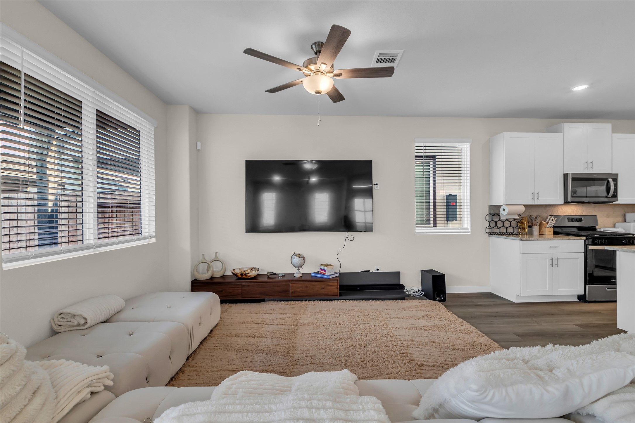 3109 Boulder Rnch Drive Houston, TX 77063 - Photo 6 of 26 a living room with furniture and a flat screen tv
