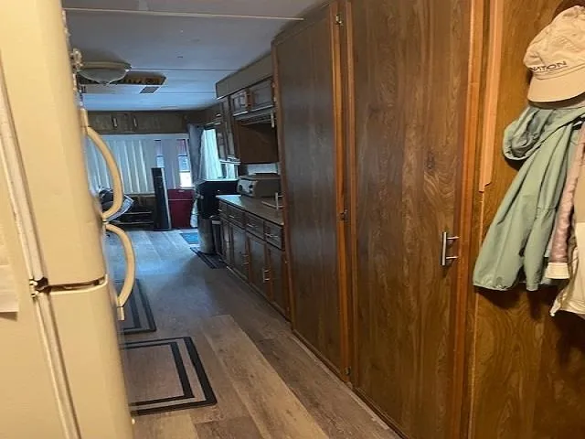 a view of a balcony with furniture and floor to ceiling window