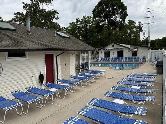 a view of a lake with a table and chairs