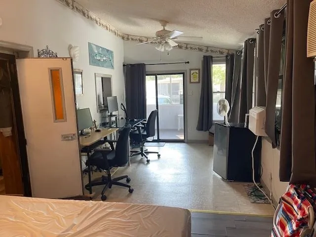 a bedroom with furniture and a window