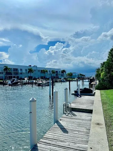 a view of a swimming pool with a yard