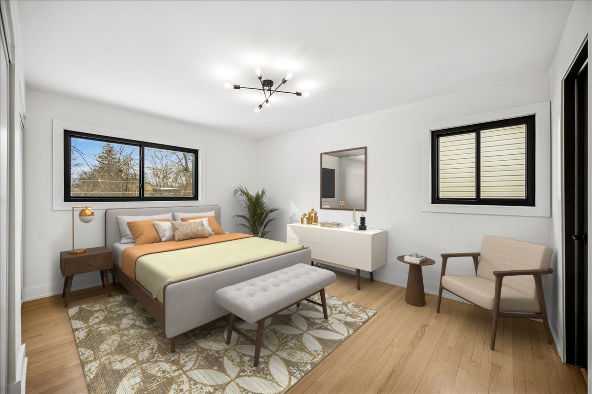 626 Barberry Road Highland Park, IL 60035 - Photo 18 of 38 a spacious bedroom with a bed a table and painting on the wall