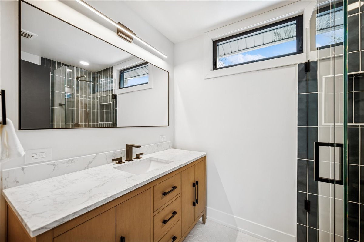 626 Barberry Road Highland Park, IL 60035 - Photo 20 of 38 a bathroom with a sink and a mirror