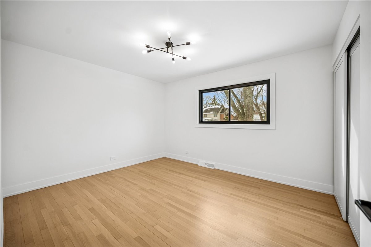 626 Barberry Road Highland Park, IL 60035 - Photo 22 of 38 a view of an empty room with a window