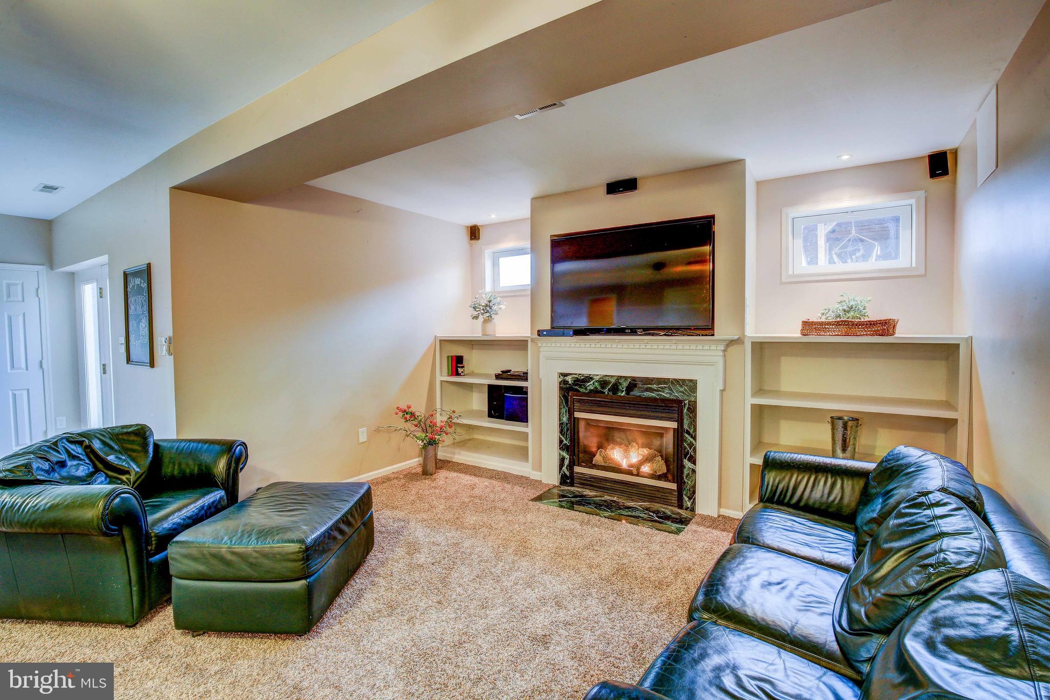 6160 Scaggs Road Owings, MD 20736 - Photo 50 of 71 2nd Fireplace with Built-in Bookshelves